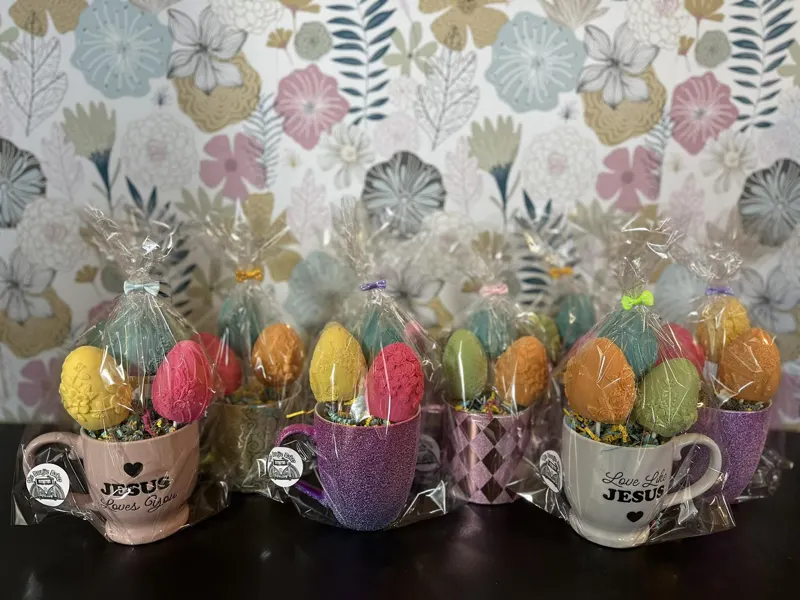 Easter egg cake pops arranged in mugs