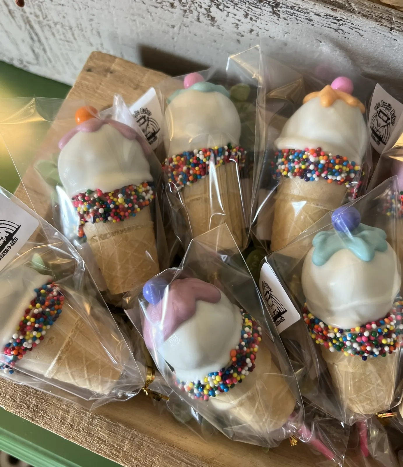 Cake pops made to look like ice cream cones with sprinkles
